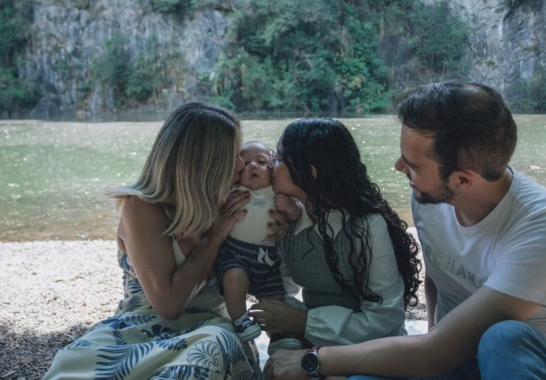 Family enjoying quality time together by the scenic riverside backdrop.